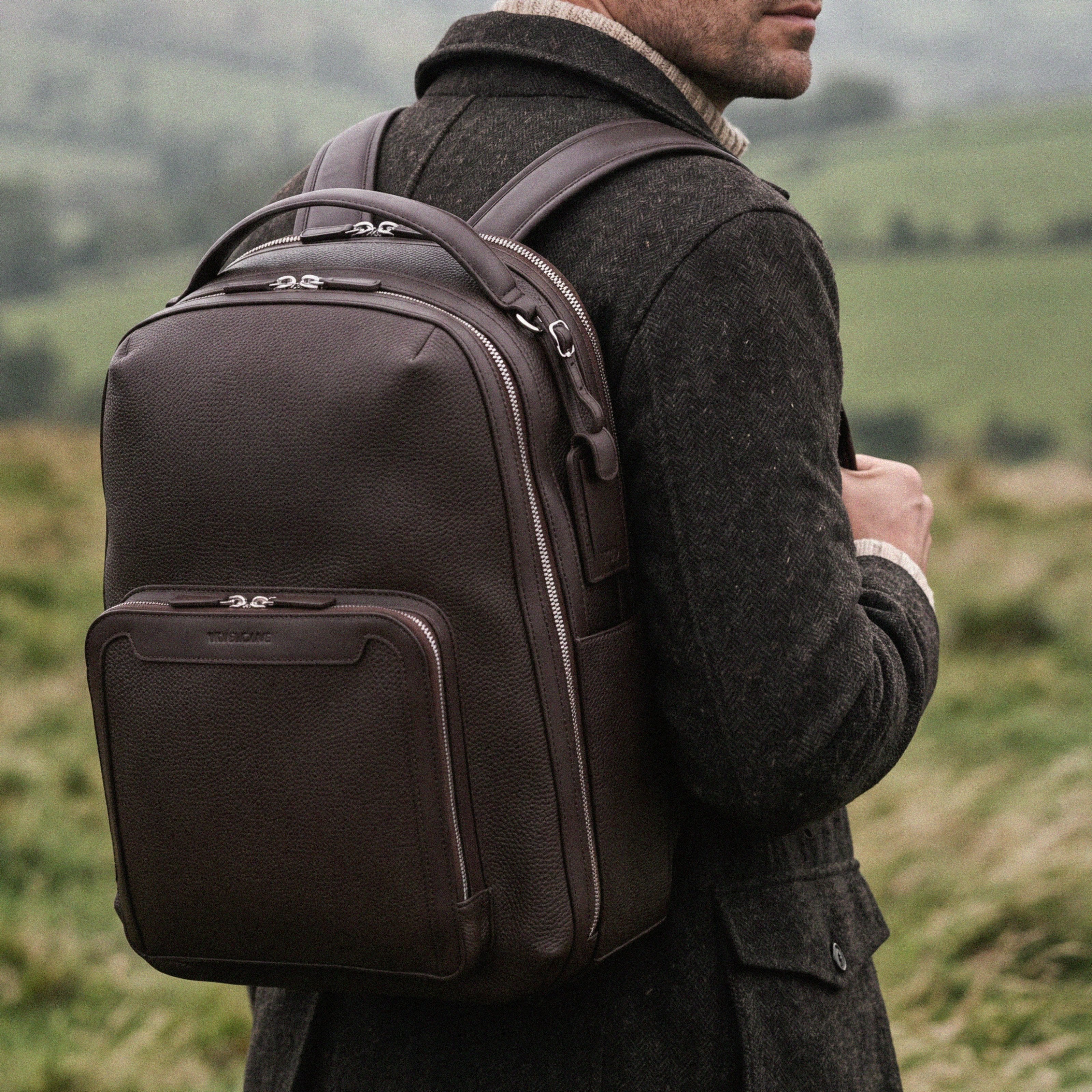 Pilot Travel Backpack worn by a man in the highlands| #color_Chocolate