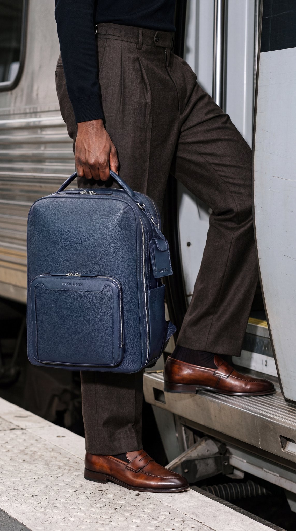 Pilot Travel Backpack carried by a man boarding a train | #Color_Navy