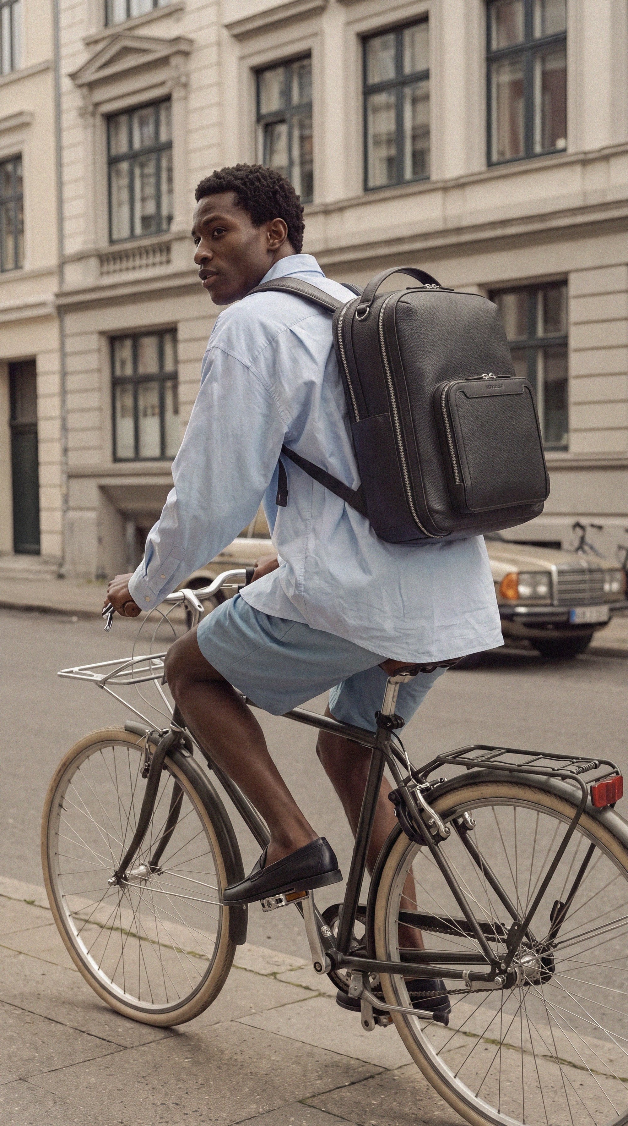 Pilot Travel Backpack worn by a man commuting by bike | #Color_Jet Black