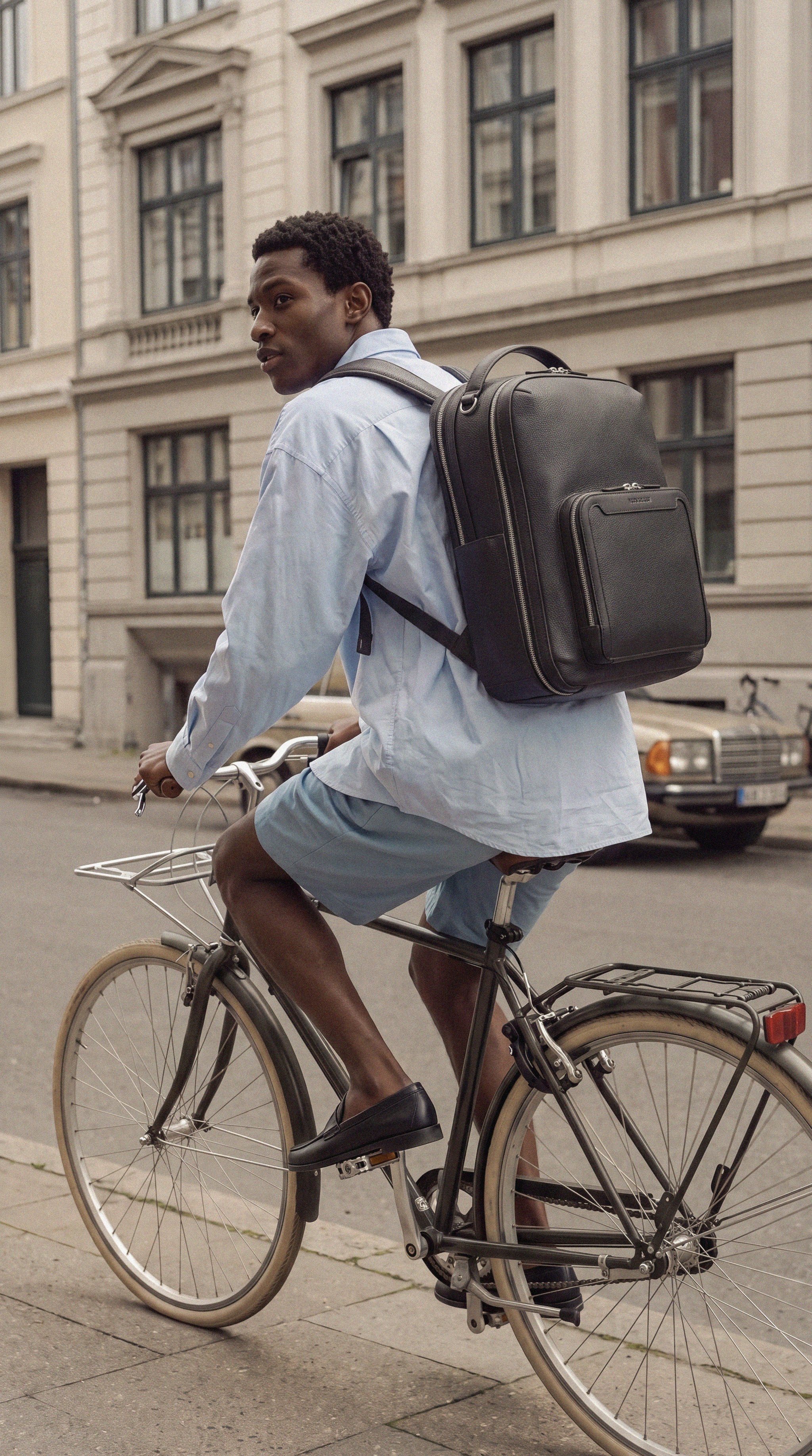 Pilot Travel Backpack worn by a man commuting by bike | #Color_Jet Black
